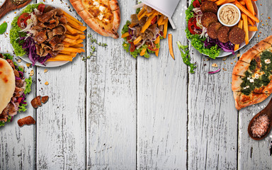 Top down view on traditional turkish meals on vintage wooden table. - obrazy, fototapety, plakaty