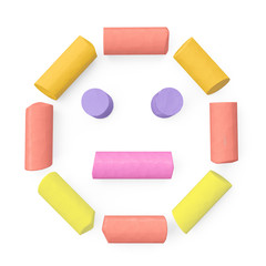 Colored sidewalk or blackboard chalks assembled like face happy emoticon on rough blackboard, 3D rendered