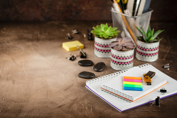 Notepad and succulents on the table. The Business Concept.