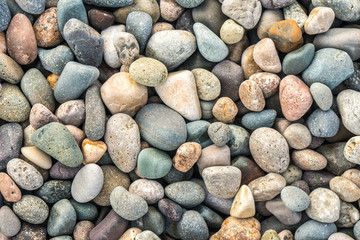 Close up of rounded and polished beach rocks