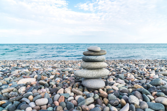 Stack of stones on the sea beach, stone balance