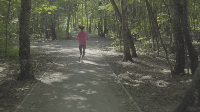 Girl runs through park, color profile Slog3