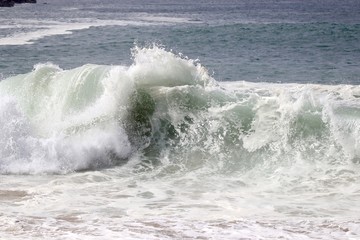 Large powerful wave crashing in the ocean 