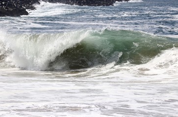 Large powerful wave crashing in the ocean 