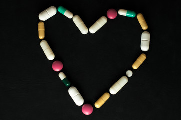 Heart made of pills. Symbol of love.