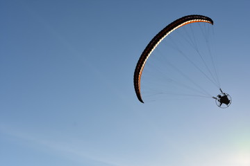 Powered Paragliding In Blue Sky