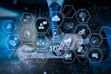 Fototapeta premium businessman hand working with modern technology and digital layer effect as business strategy concept