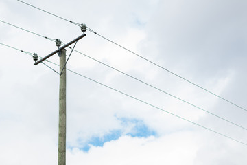 Wooden electricity pole in a cloudy day