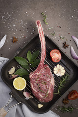 Steak in the pot for cooking, with space for writing