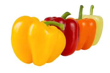 Fresh vegetables. Sweet red, yellow, green,  orange  peppers isolated on white background.