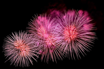 Outbreaks of festive pink salute fireworks
