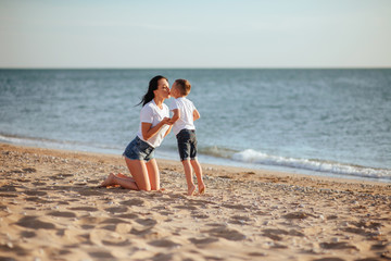 Young mother with son in white T-shirts