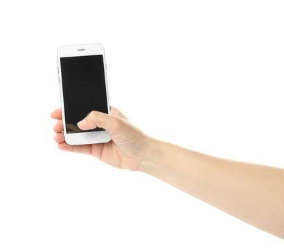 Woman with mobile phone taking selfie on white background