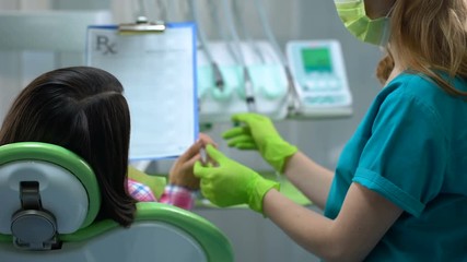 Patient signing dental insurance before surgery or treatment, prescriptions