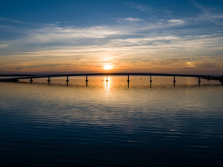 Fototapeta na wymiar Sunset behind bridge on island Vir, bridge over Adriatic sea
