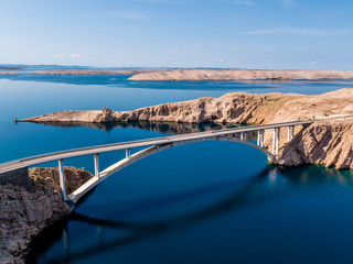 Bridge road to island Pag, Pag is a Croatian island in the Adriatic Sea. It’s known for its barren, moonlike landscape, lace production and Pag cheese. Pebble and sand beaches ring the island, drone