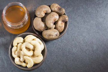Walnuts and cashew oil on the table - Anacardium occidentale