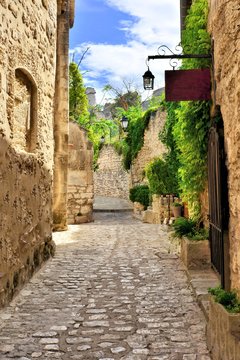Fototapeta Rustic old street in the village of Les Baux de Provence, southern France