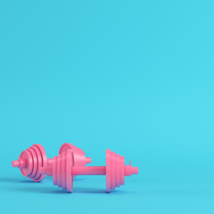 Abstract pink dumbbells bright blue background in pastel colors