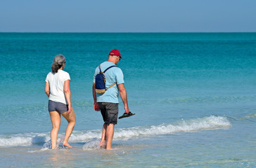 Unidentified Couple Walking on Beach