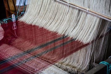 Traditional silk weaving loom. Royal brocade is produced using golden and silver threads