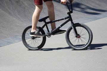 Fototapeta na wymiar teenager riding a bike on a special roller coaster