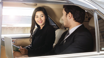 business people smart man and woman talk in back seat car