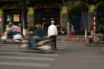 Crossing The Busy Streets of Hanoi, Vietnam