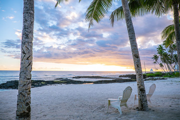 Two deck chairs at sunset on an empty beach at Lefaga, Matautu, Upolu Island, Samoa, South Pacific