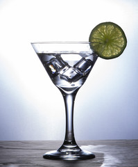 martini glass with lime cocktail