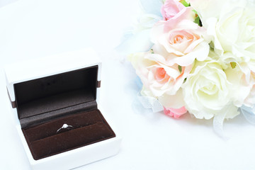 engagement ring and bridal bouquet