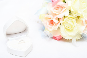 engagement ring and bridal bouquet
