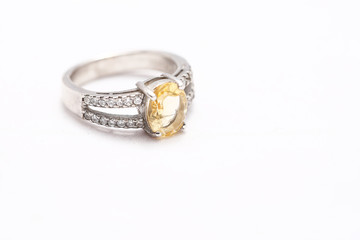 Yellow gem stone on diamond ring