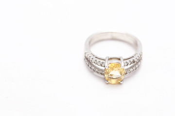 Yellow gem stone on diamond ring