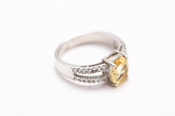 Yellow gem stone on diamond ring