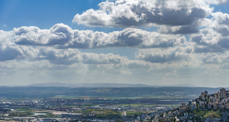 Fototapeta premium View from the top to city of Haifa in Israel and harbor at spring time.