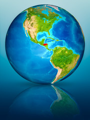 Honduras on Earth on reflective surface
