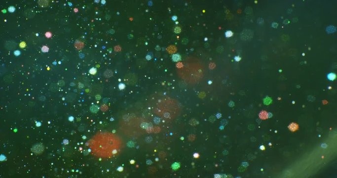 Color drops floating in oil and water over a colorful underground with oil painting effect. 4K.
