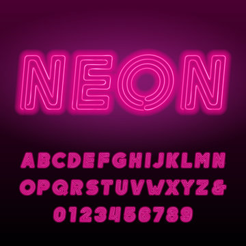 Pink neon tube alphabet font. Neon color bold oblique letters and numbers. Retro vector typeface for your design.