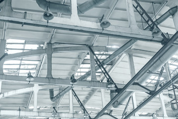 ventilation system with lights on the ceiling of industrial building