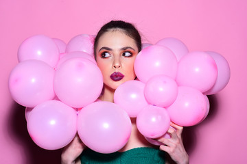 Fototapeta na wymiar Fashion woman with many pink air balloons. fashion balloon party with pretty woman.