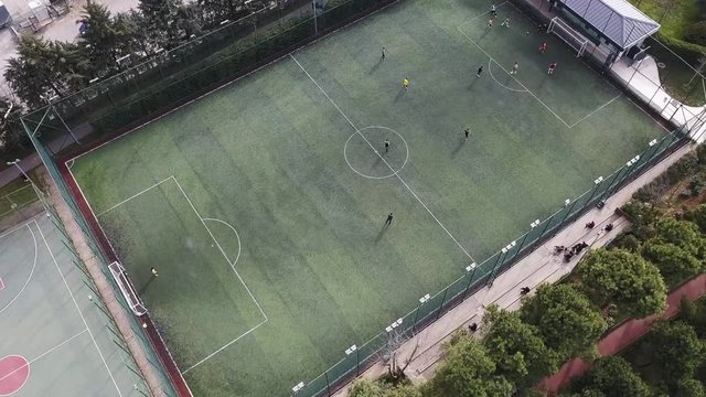 Aerial view of a Soccer Play on the grass football field