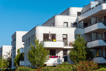 Modern white residential construction with garden seen in Munich, Germany