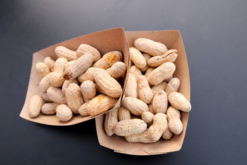 Salt-roasted peanuts in box.
