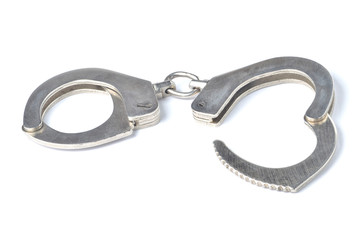Metal police handcuffs isolated on white background