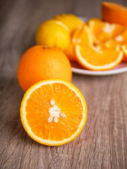 Half slide of fresh nature ripe orange on wooden table