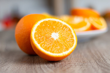 Half slide of fresh nature orange on wooden table