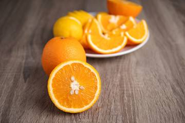 Half slide of fresh nature ripe orange on wooden table