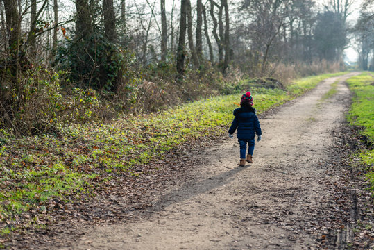 Toddler Walking Alone On A Desolate Country Road