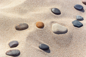 beautiful stones different colours on the sand